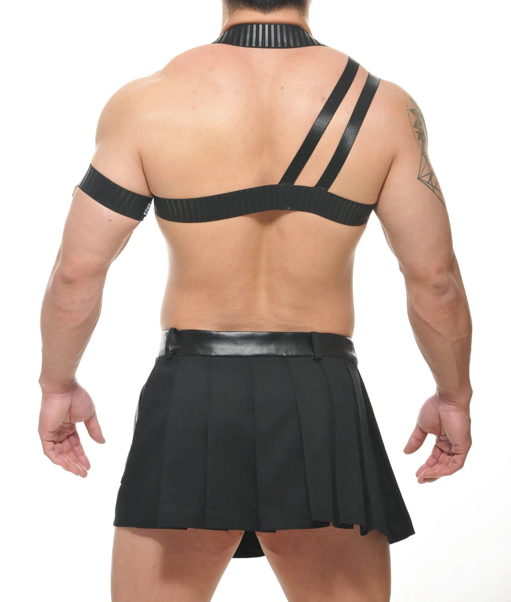 Black leather beta spartan harness with ribbed texture and matching pleated skirt front view