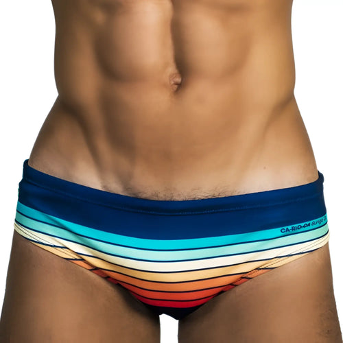 Sunset Sunga men’s designer swim trunks with vibrant retro horizontal stripes in blue teal white orange and red