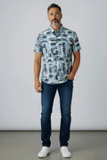 A man wearing a suslo crinkled fabric short-sleeved shirt with an abstract gray and white geometric pattern