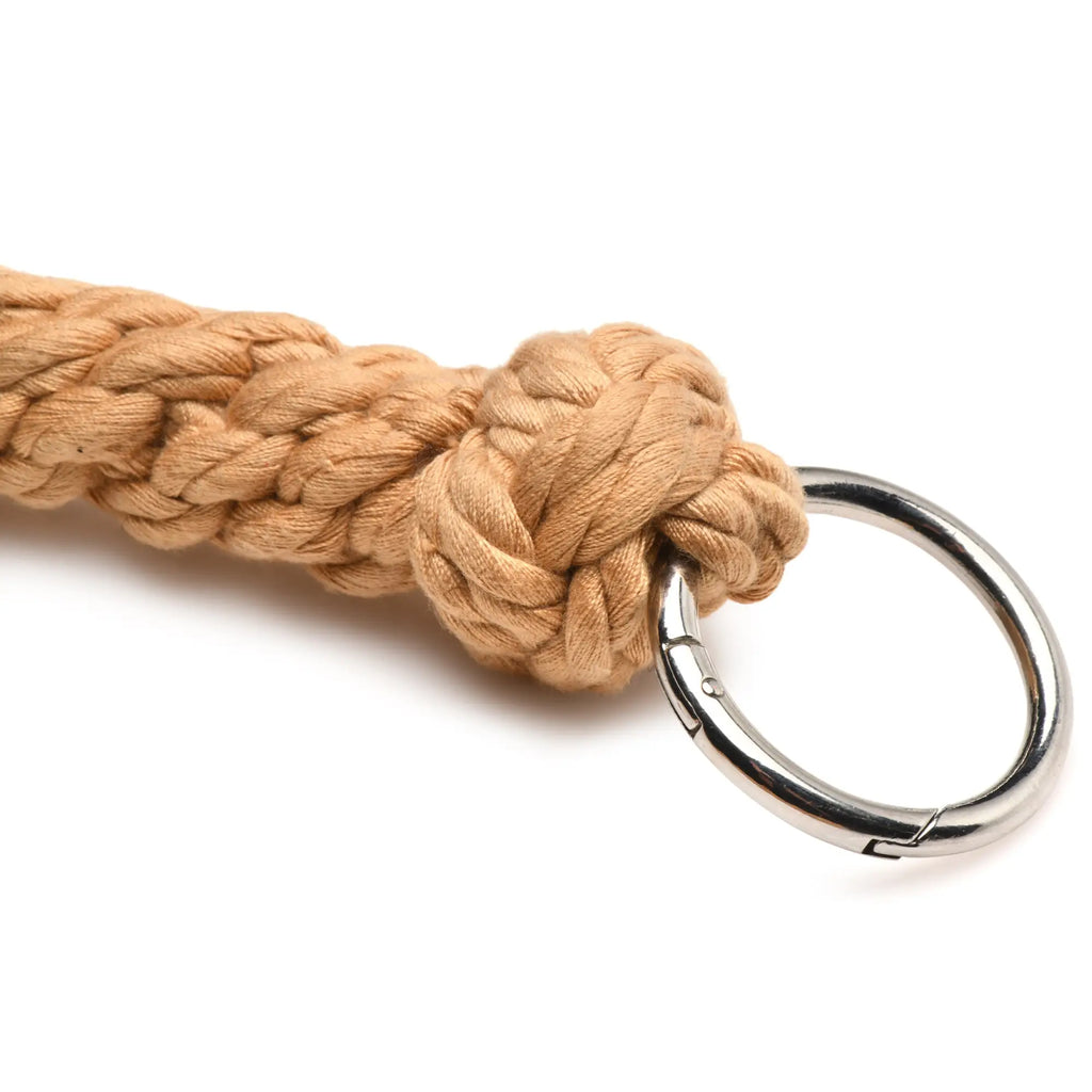 Tan braided rope keychain with silver-toned metal carabiner clip from swashbuckler rope flogger product line