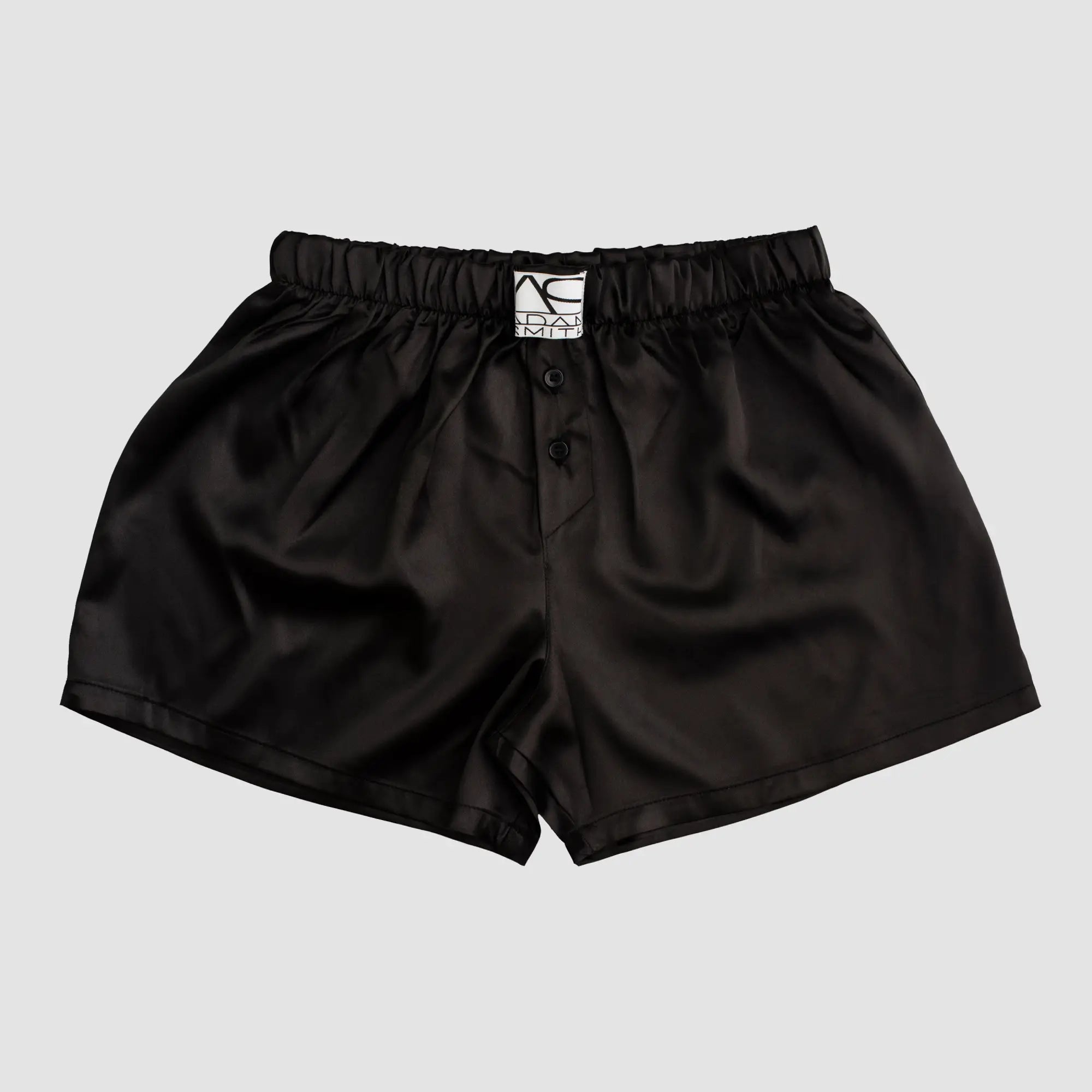 Black satin sweetheart boxer shorts with branded label and button closure for comfortable wear
