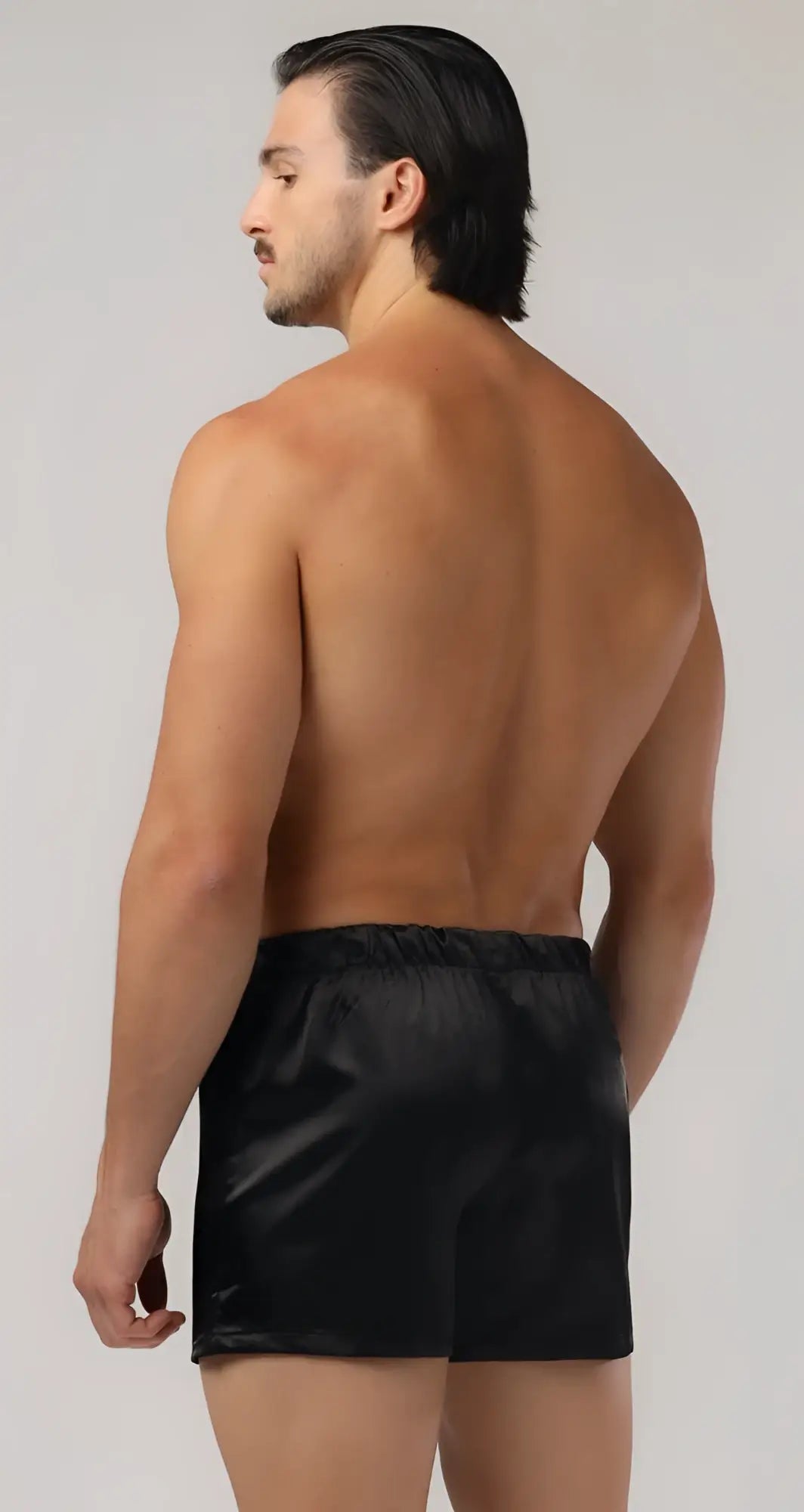 Black satin sweetheart boxer shorts with a smooth glossy finish and elastic waistband for comfortable wear