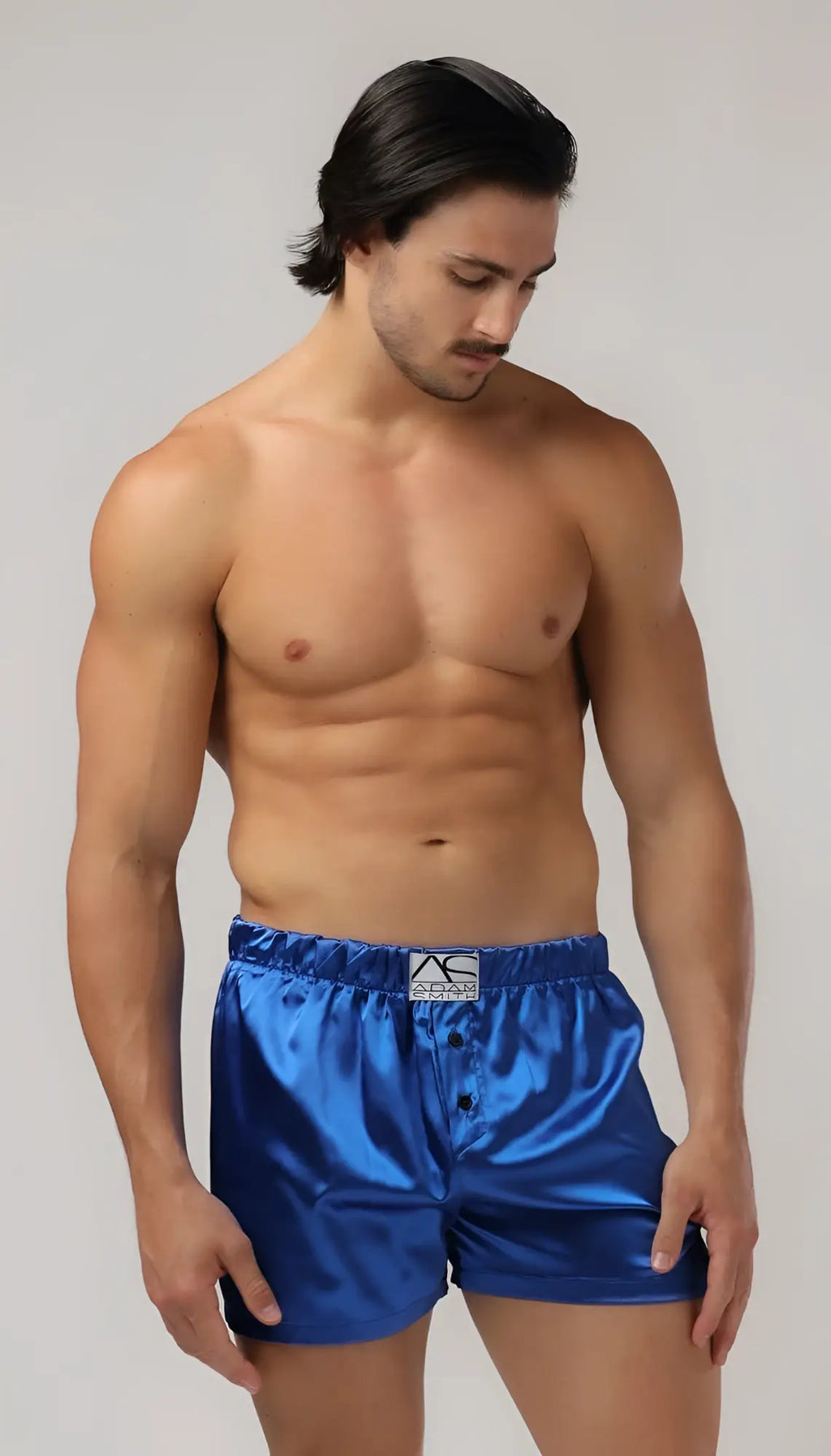 Blue satin sweetheart boxer shorts featuring a white logo on the waistband for comfortable loungewear
