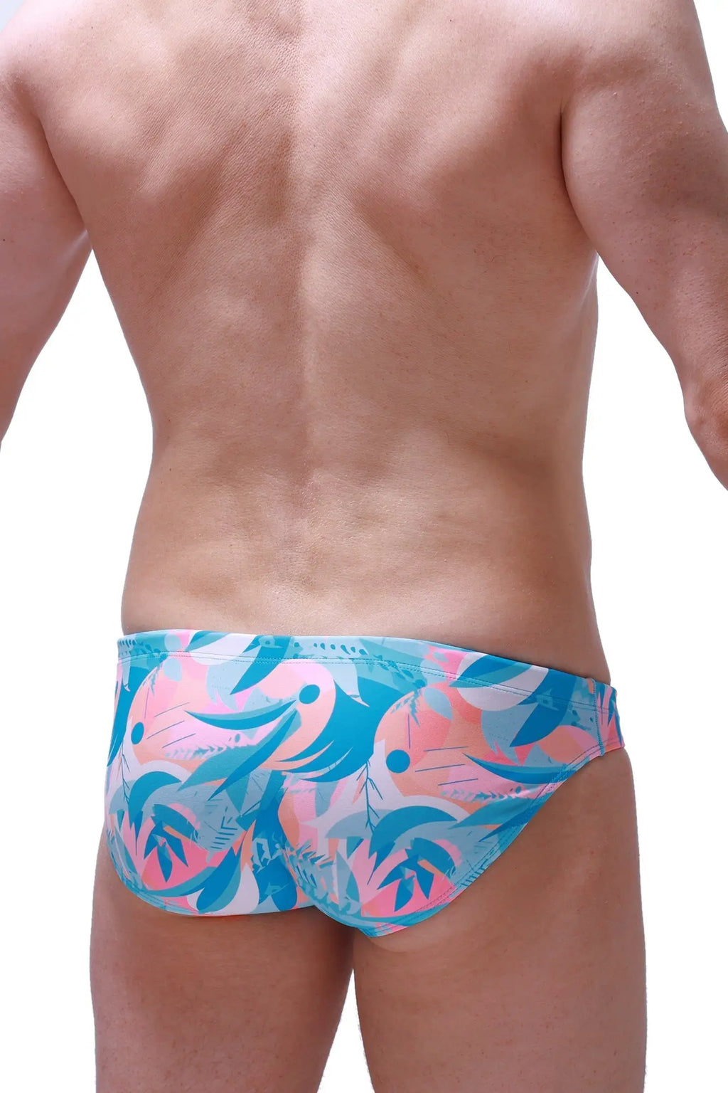 Swim brief Nant Boucan with vibrant tropical pink and teal abstract pattern perfect for beach and pool use