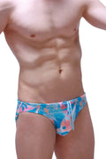Swim brief Nant Boucan in vibrant tropical print swim trunks with blue pink and teal leafy fish design