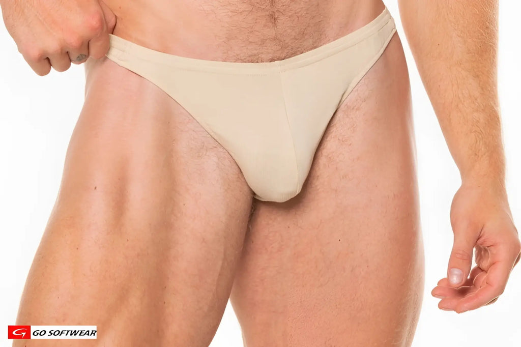 Beige t-back thong made of soft stretchy fabric with a minimalist design shown from the back side