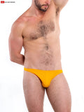 Bright yellow t-back thong briefs made of soft fabric with a form-fitting design shown from the back side