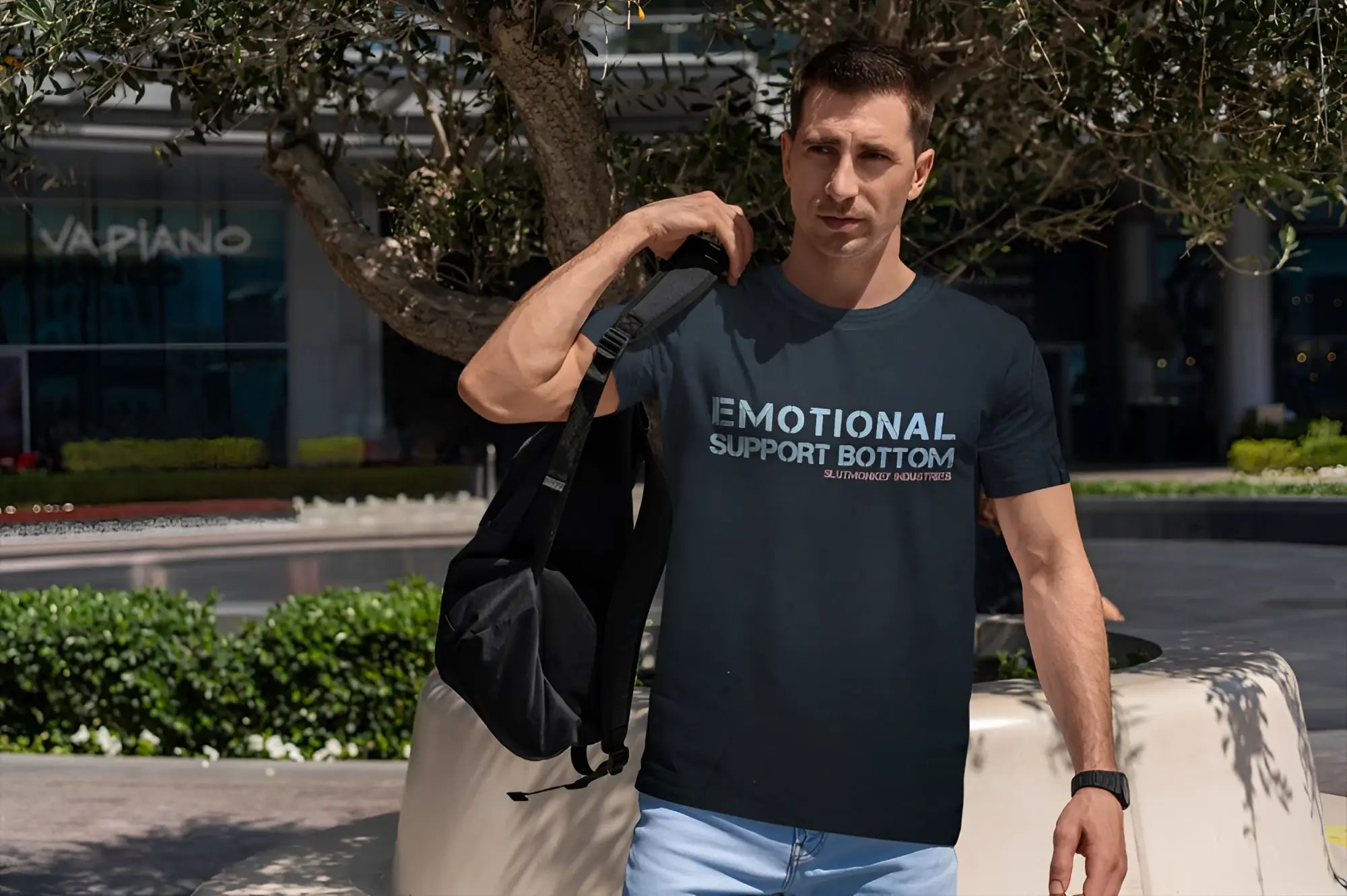 Dark navy blue short-sleeved t-shirt with white emotional support bottom text and smaller red print below in cotton material