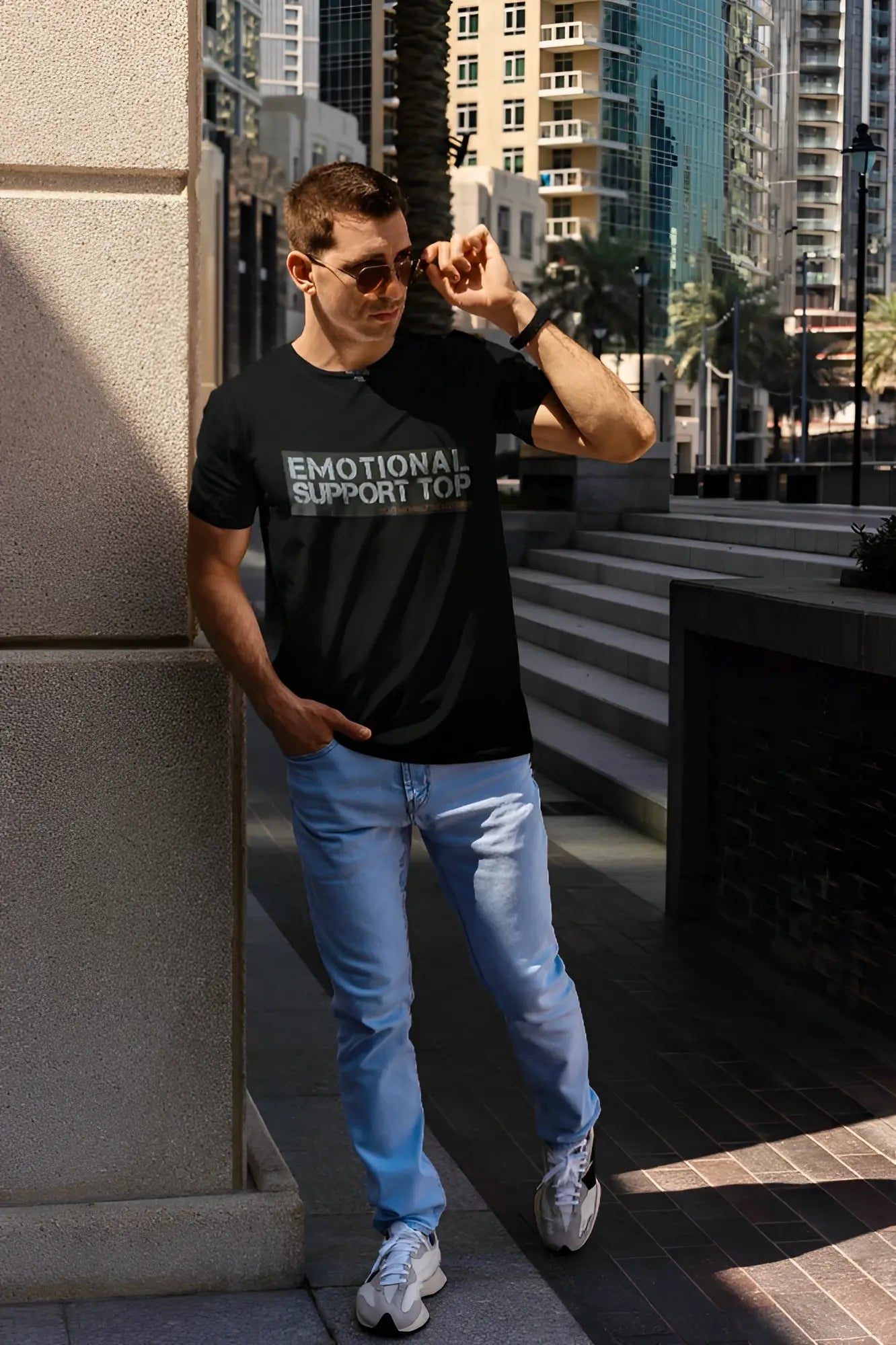 Black short-sleeved cotton t-shirt with emotional support top printed in white and gray on the chest