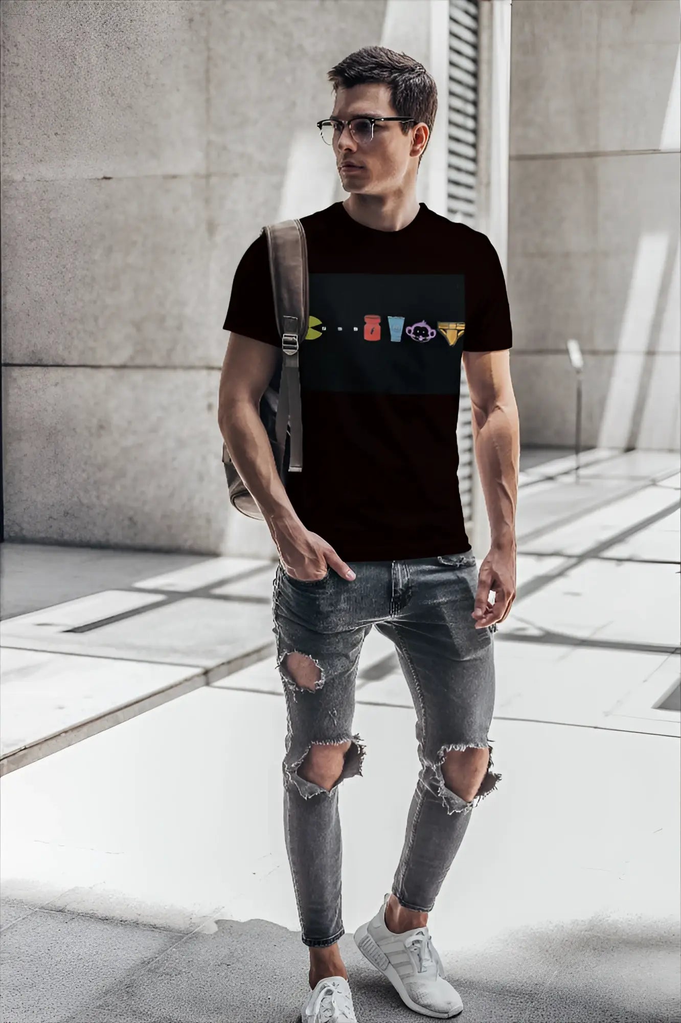 Black short-sleeved t-shirt by t-shirt monkey with colorful classic video game characters graphic design