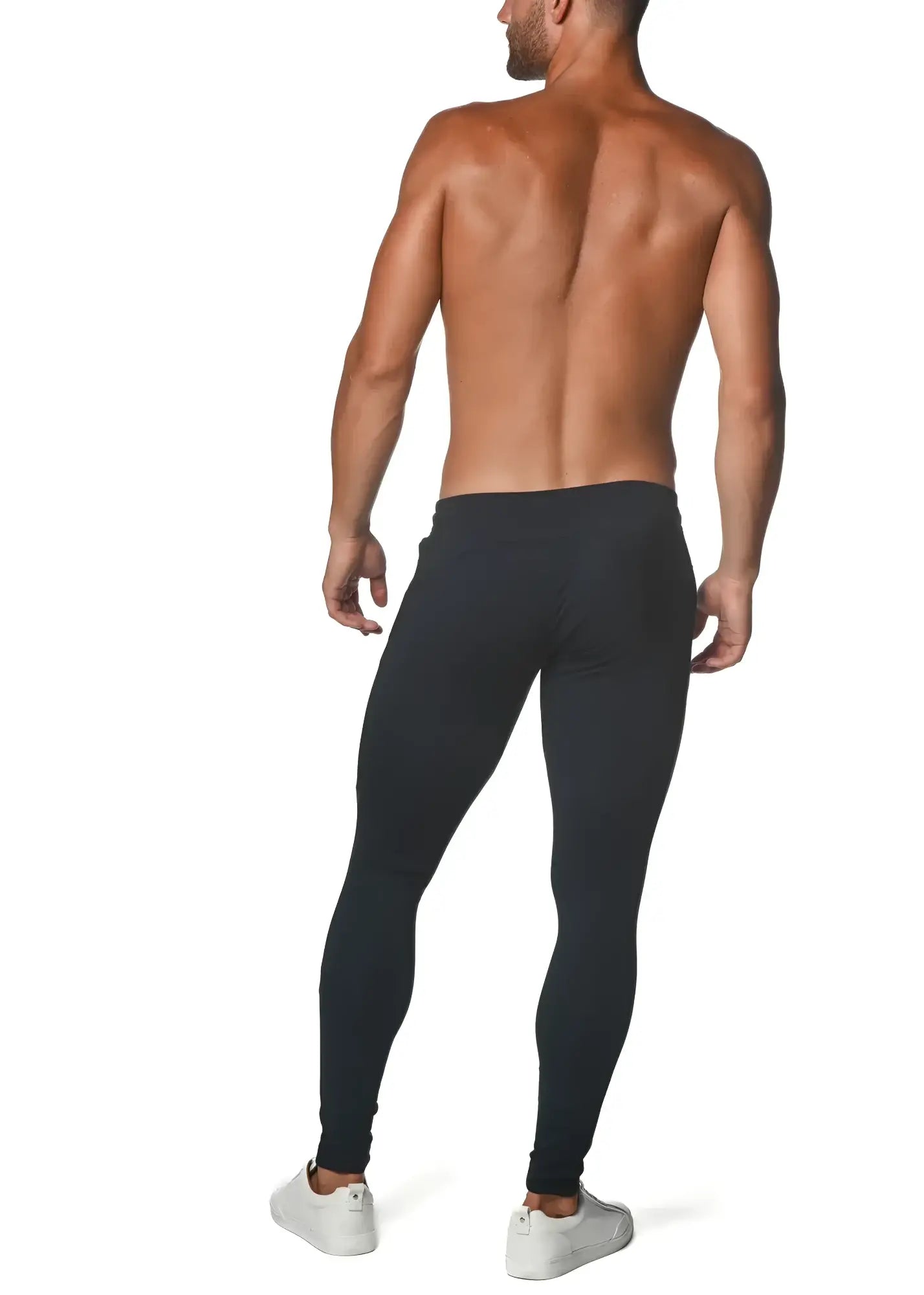 Black tactical gym-tech stretch slim jogger leggings worn by a man showing front side fit and material details