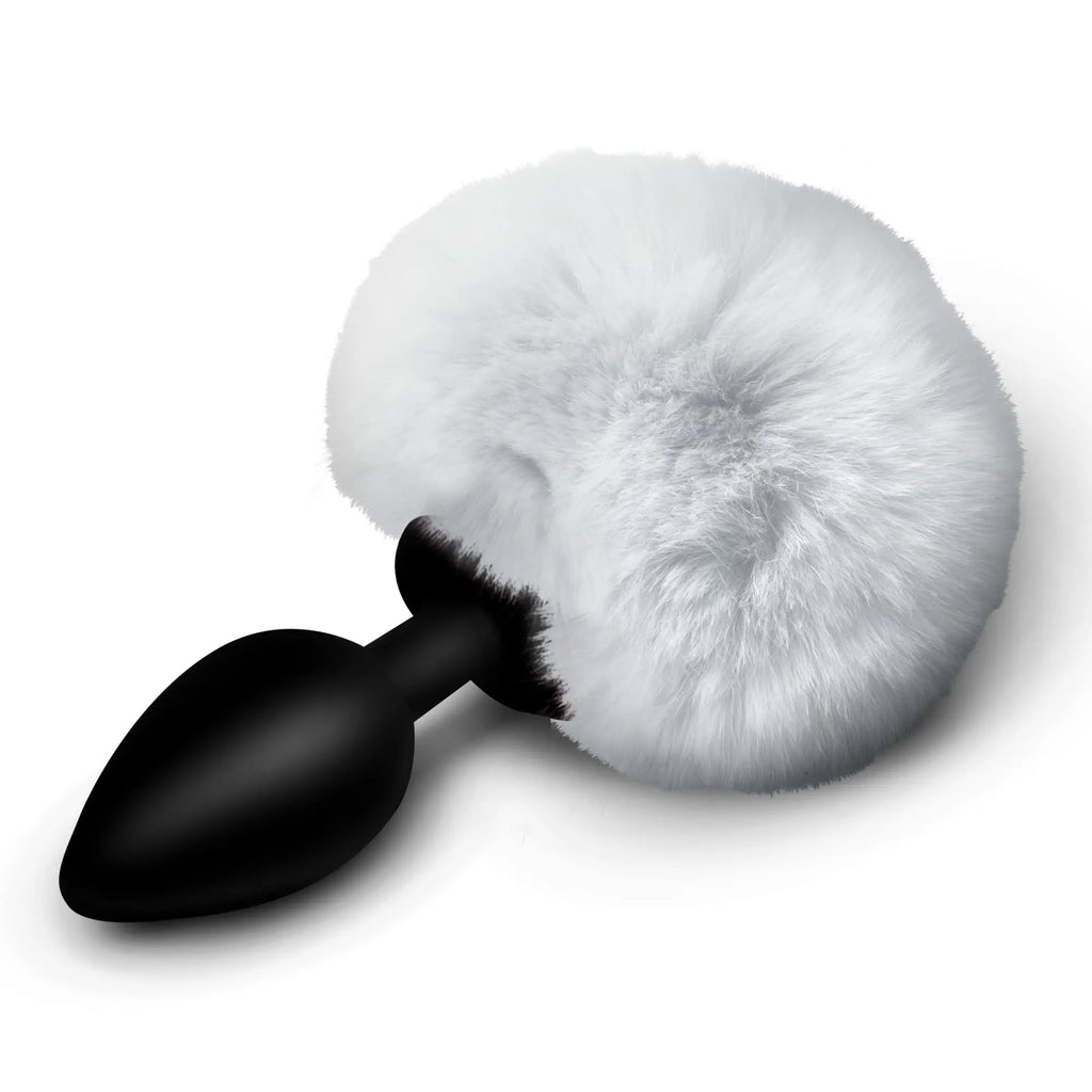 Tailz Fluffy Bunny Tail Silicone Plug: a sleek black silicone plug attached to a large, soft, round white faux-fur tail.