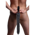 Tailz remote control vibrating anal plug with a long, fluffy grey faux fur fox tail, worn by a man from behind.