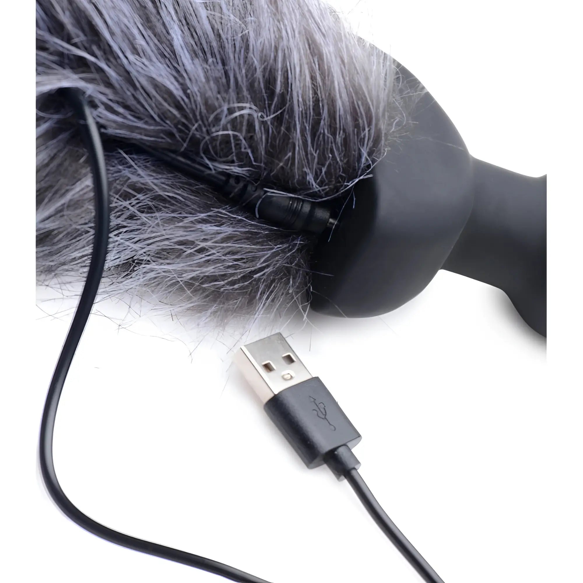 Tailz Remote Control Vibrating Fox Tail Anal Plug showing a black charging cable connecting to the base of the gray tail.