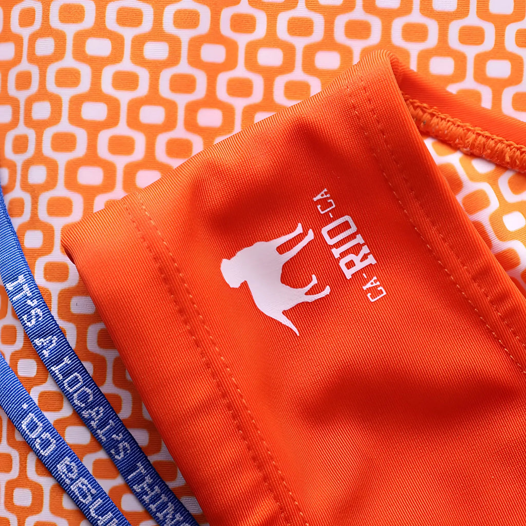Bright orange athletic swimming sunga with white silhouette logo and ca-rio-ca text embroidered for men beachwear