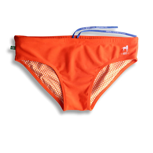 Tangerine solids men’s swimming sunga with bright orange swim trunks geometric patterned lining and blue drawstrings