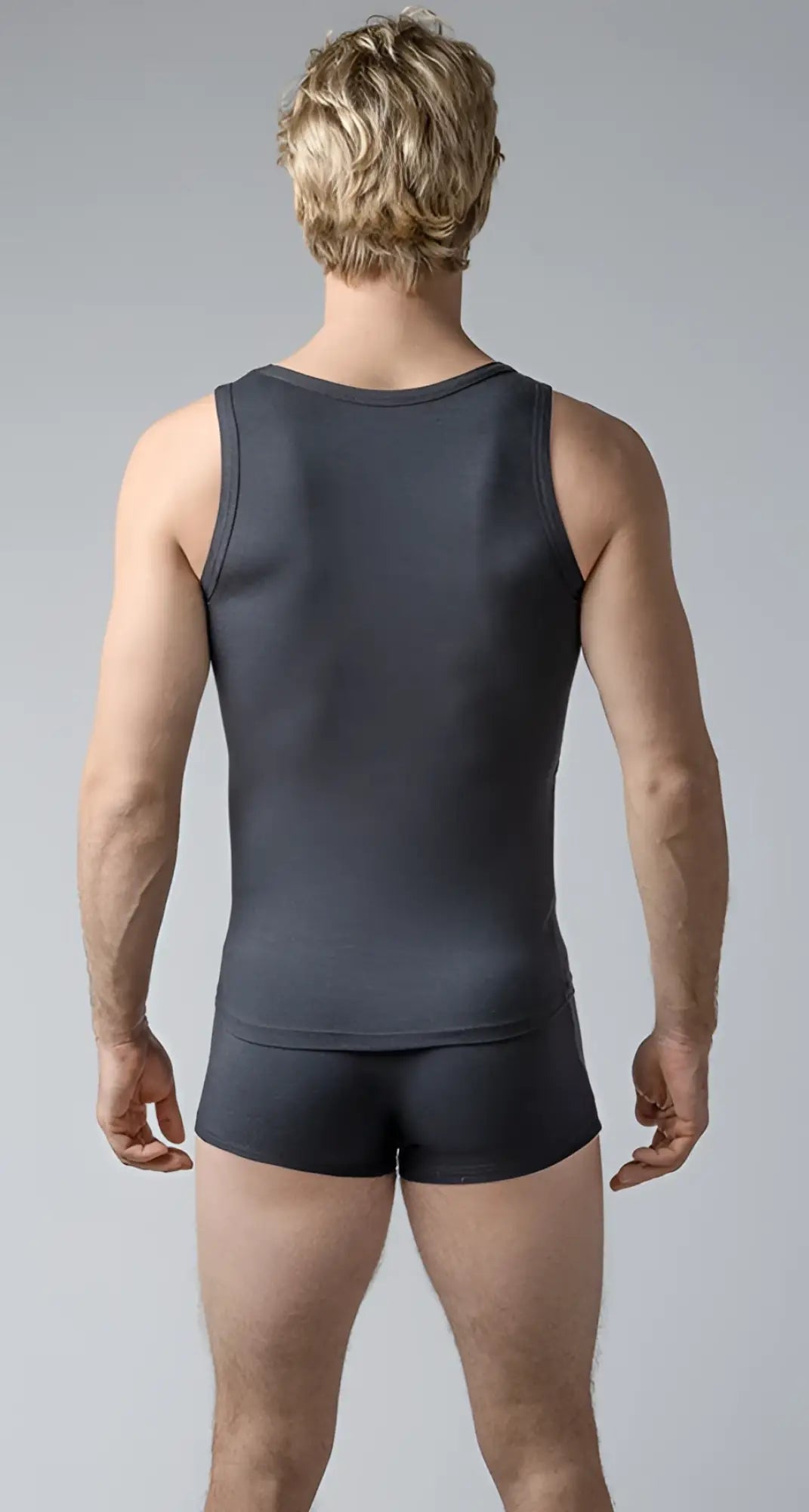 Dark gray sleeveless tank top with matching shorts made of smooth fabric for casual wear