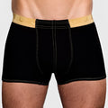 Black Tartarus Monaco trunk boxer briefs with gold embossed horseshoe waistband and white contrast stitching