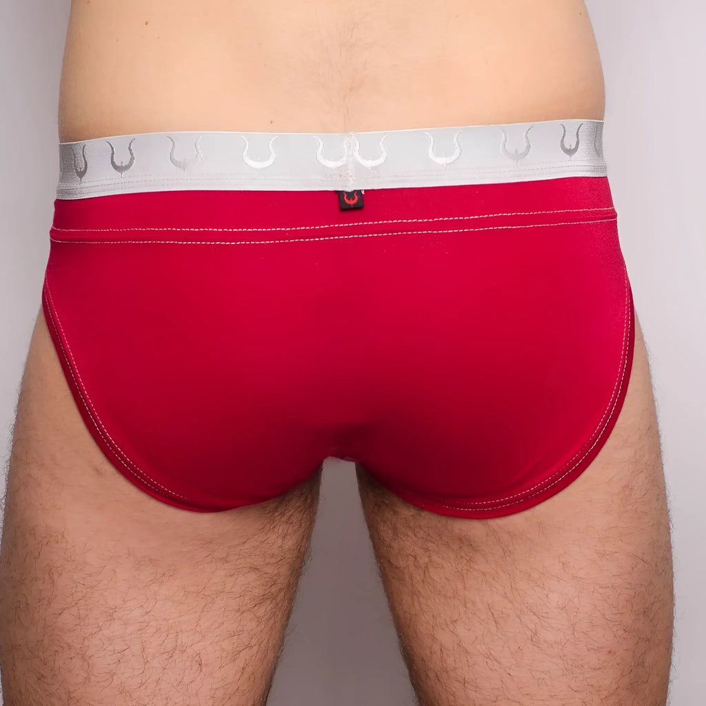 Red Tartarus Rio brief with silver horseshoe waistband and white stitching showing front side design