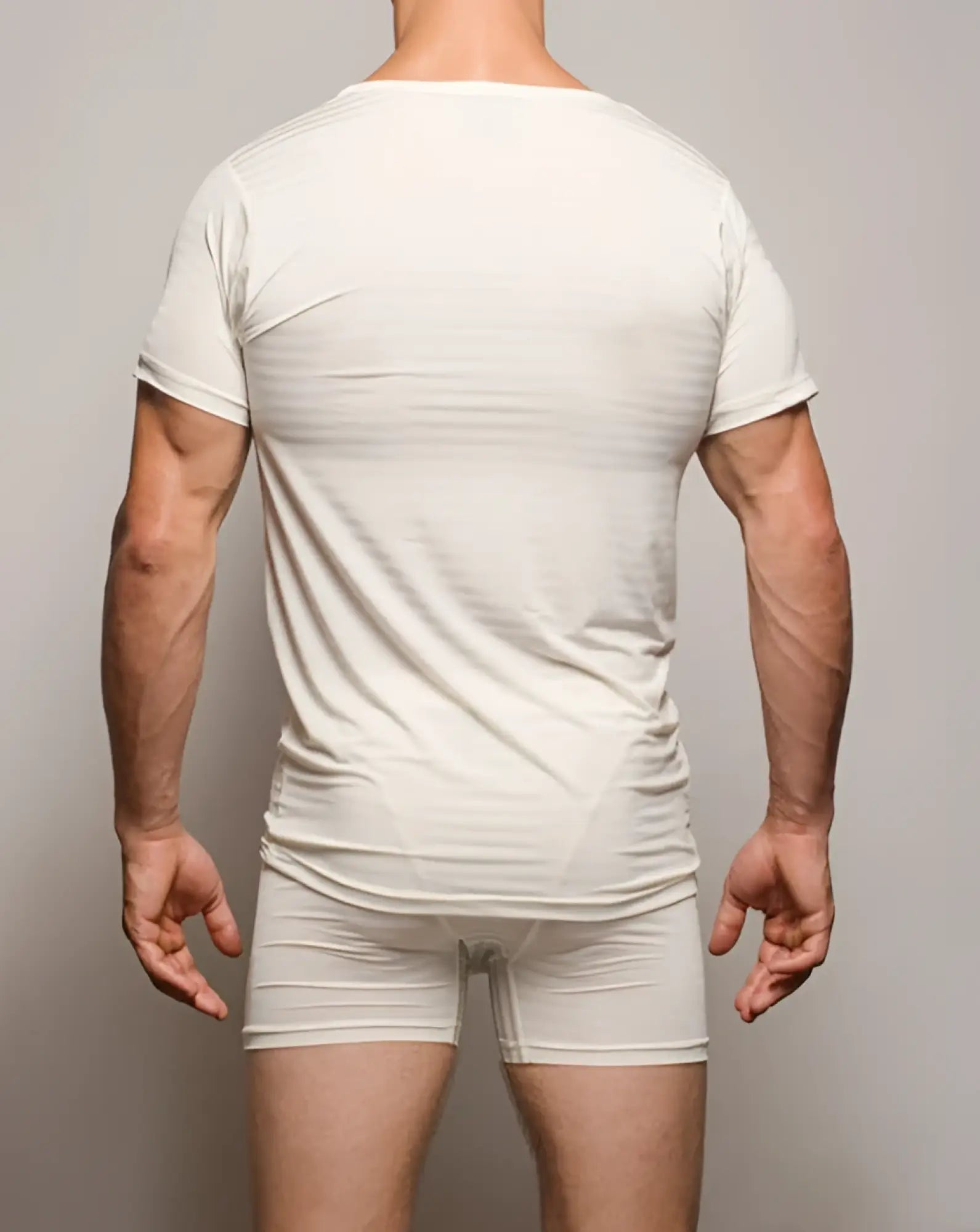 A sleek white seamless active t-shirt made of form-fitting cotton with short sleeves and rounded neckline