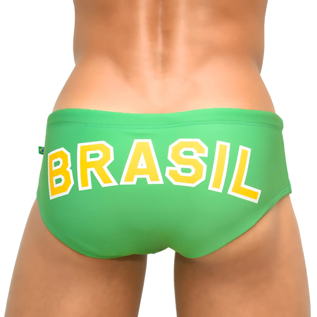 Green men’s designer swim trunks with bold yellow brasil lettering white trim and a small brazilian flag tag on side