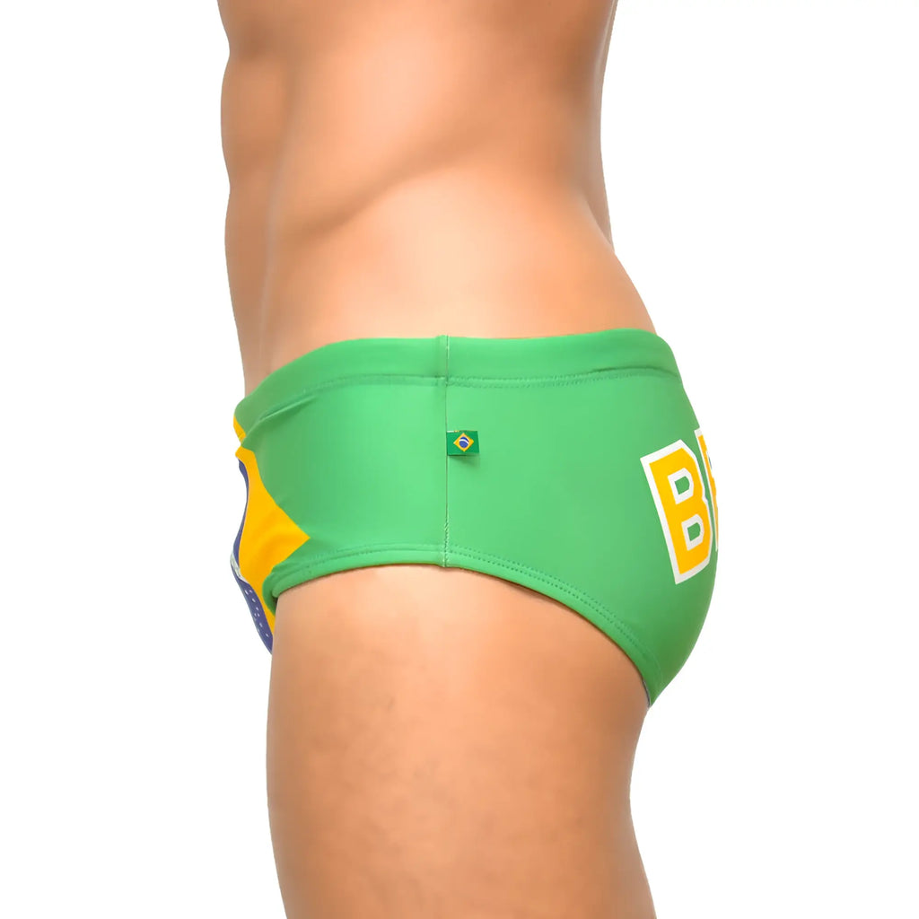 Green and yellow brazilian flag-themed men’s designer swimwear sunga with bold b logo on the side for beach use