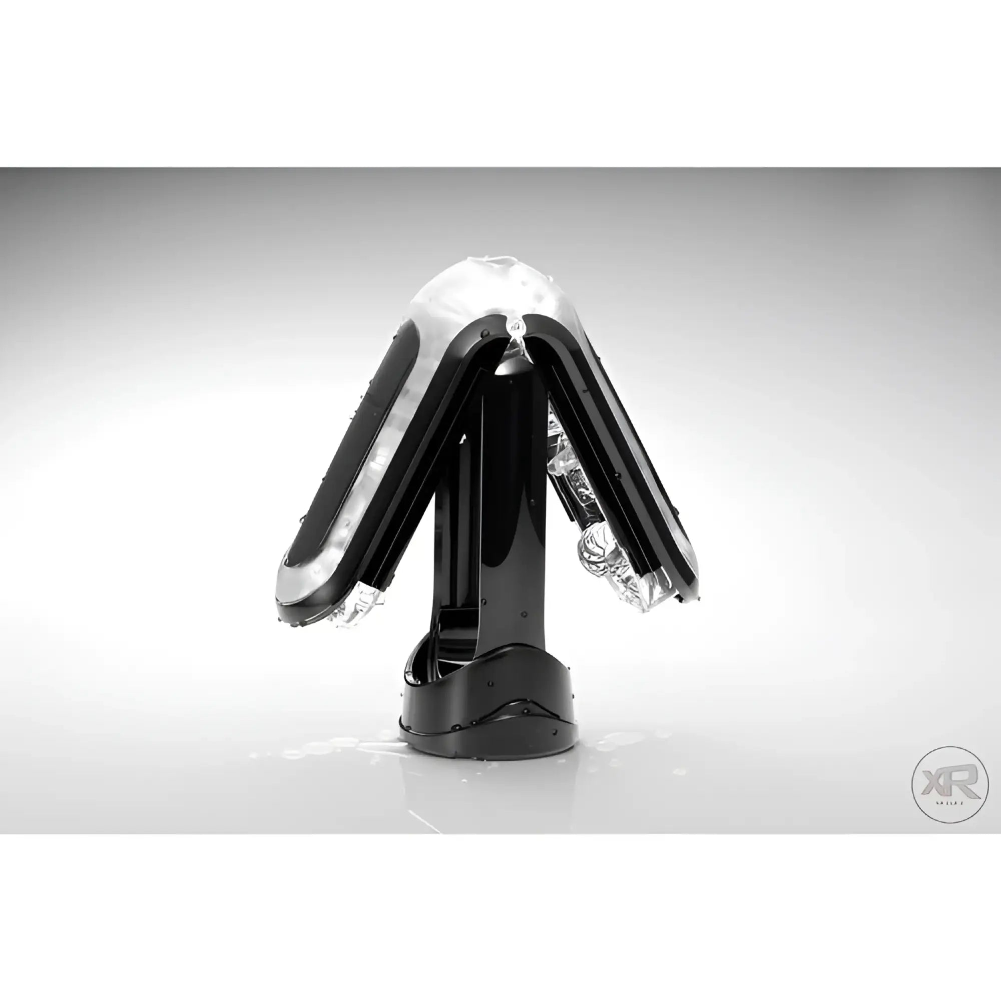 Tenga Flip 0-Zero Black standing open, revealing a detailed, transparent textured inner sleeve against a grey backdrop.