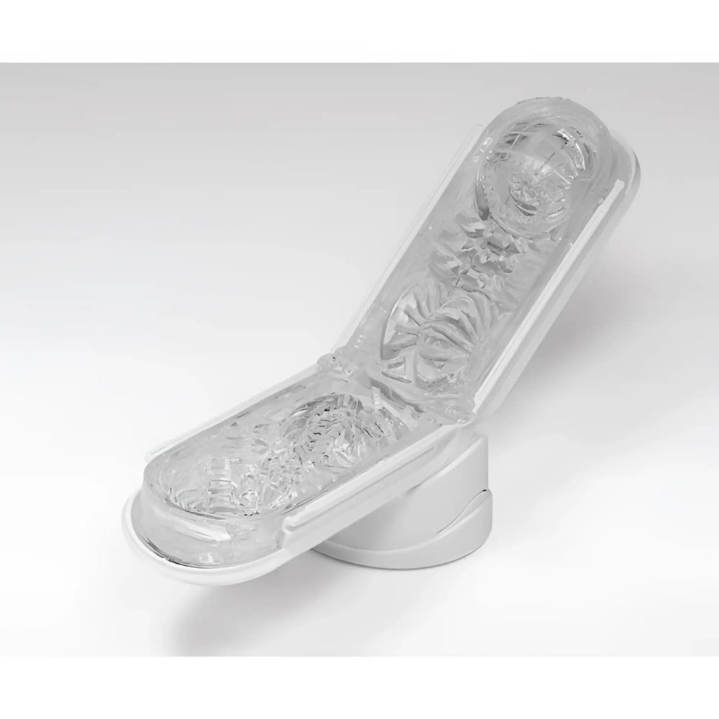 Tenga Flip 0 (Zero) open, revealing the transparent, textured silicone interior with a white base.