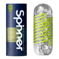 Tenga Spinner 03 Shell stroker in blue packaging next to its clear, capsule-shaped device with a lime green spiral.