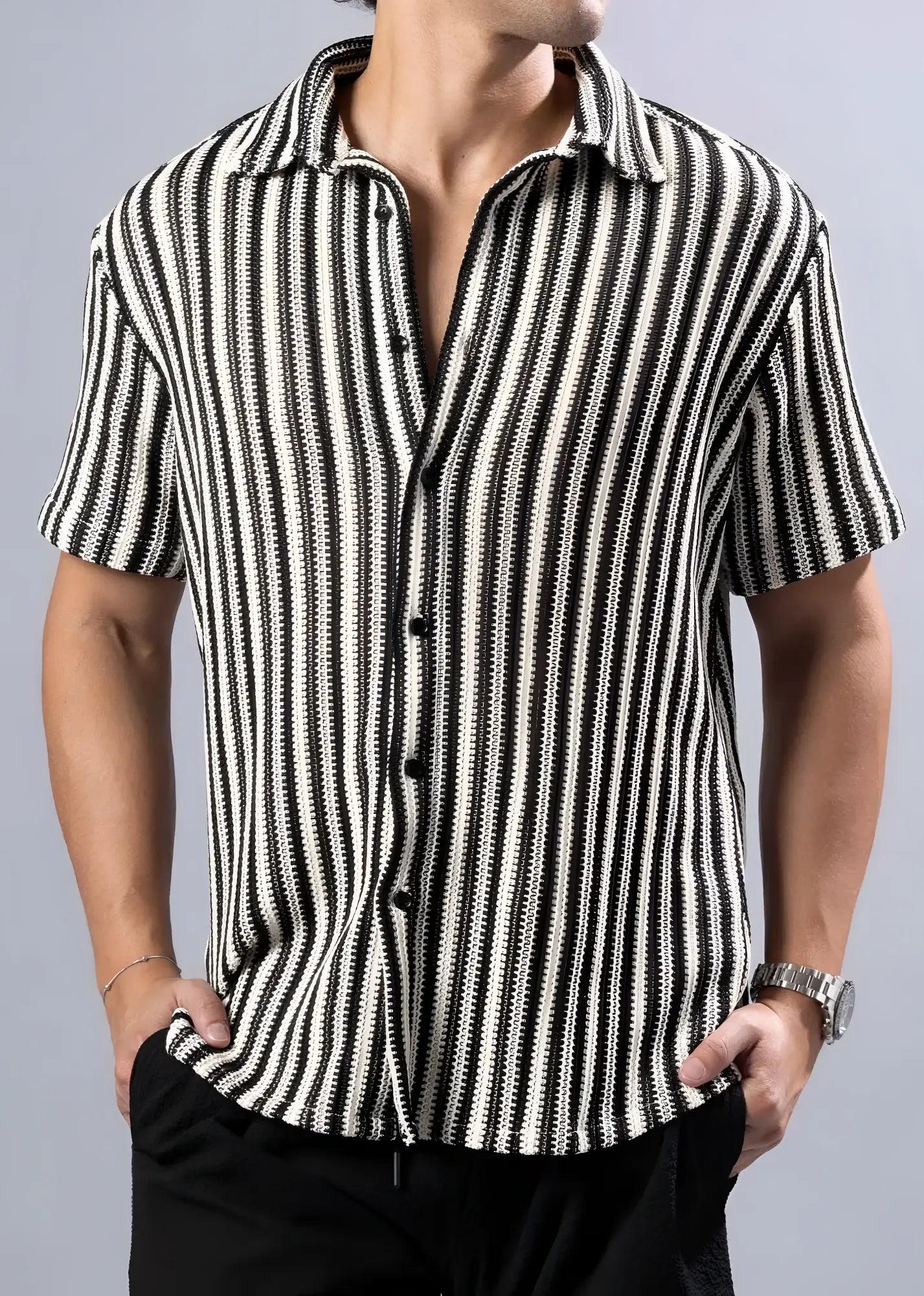 Black and white vertically striped short-sleeved button-up shirt with a textured knit pattern for casual wear