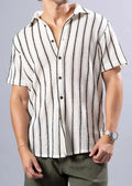 Texture knit short-sleeved button-up shirt with vertical black and cream stripes made of textured fabric