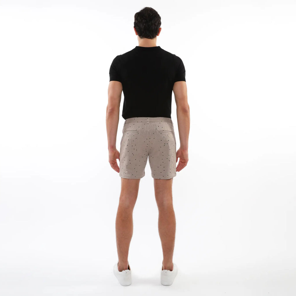 Beige textured jacquard stretch chino shorts with subtle black dot pattern and classic tailored fit with two front pockets