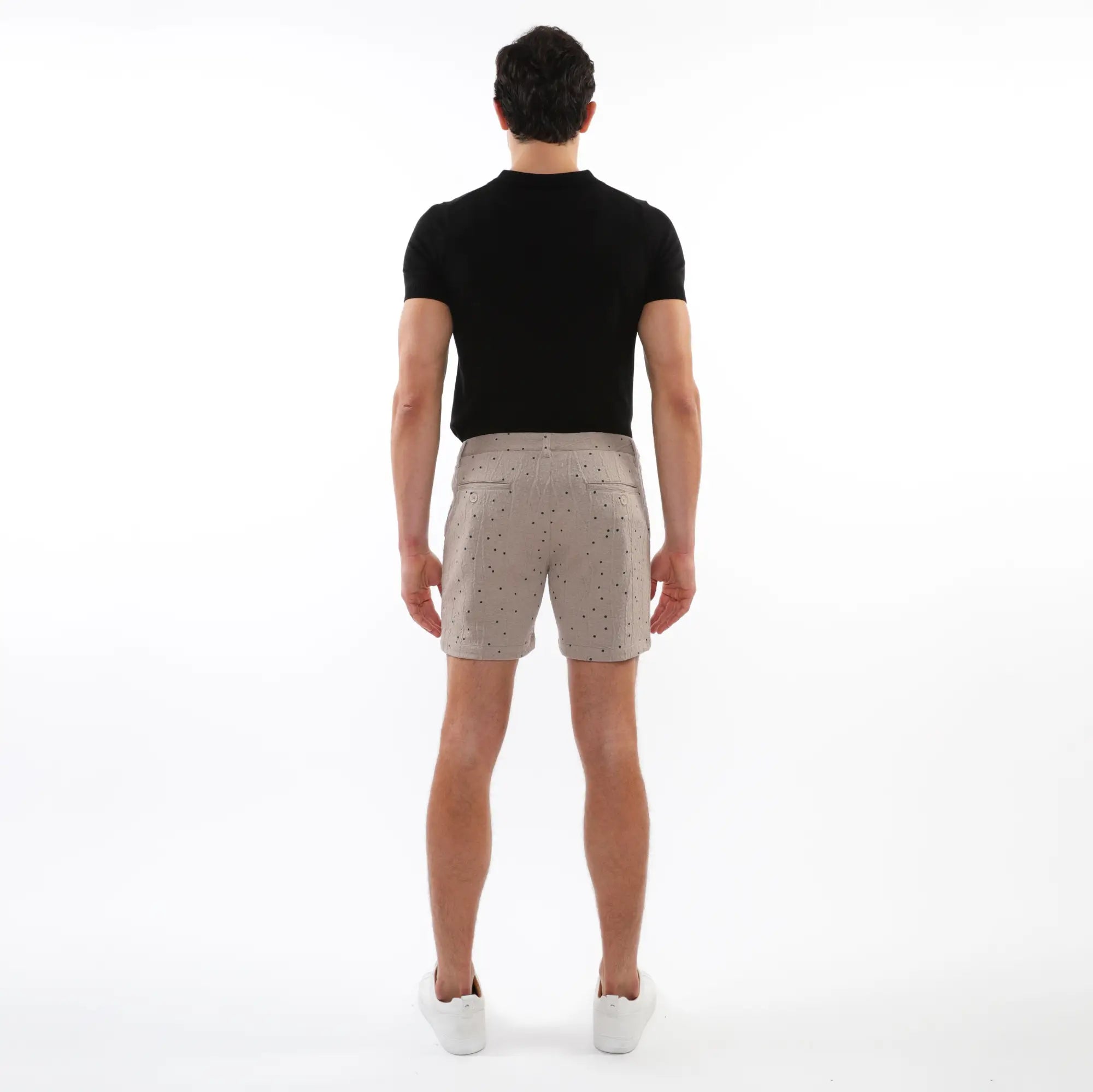 Beige textured jacquard stretch chino shorts with subtle black dot pattern and classic tailored fit with two front pockets