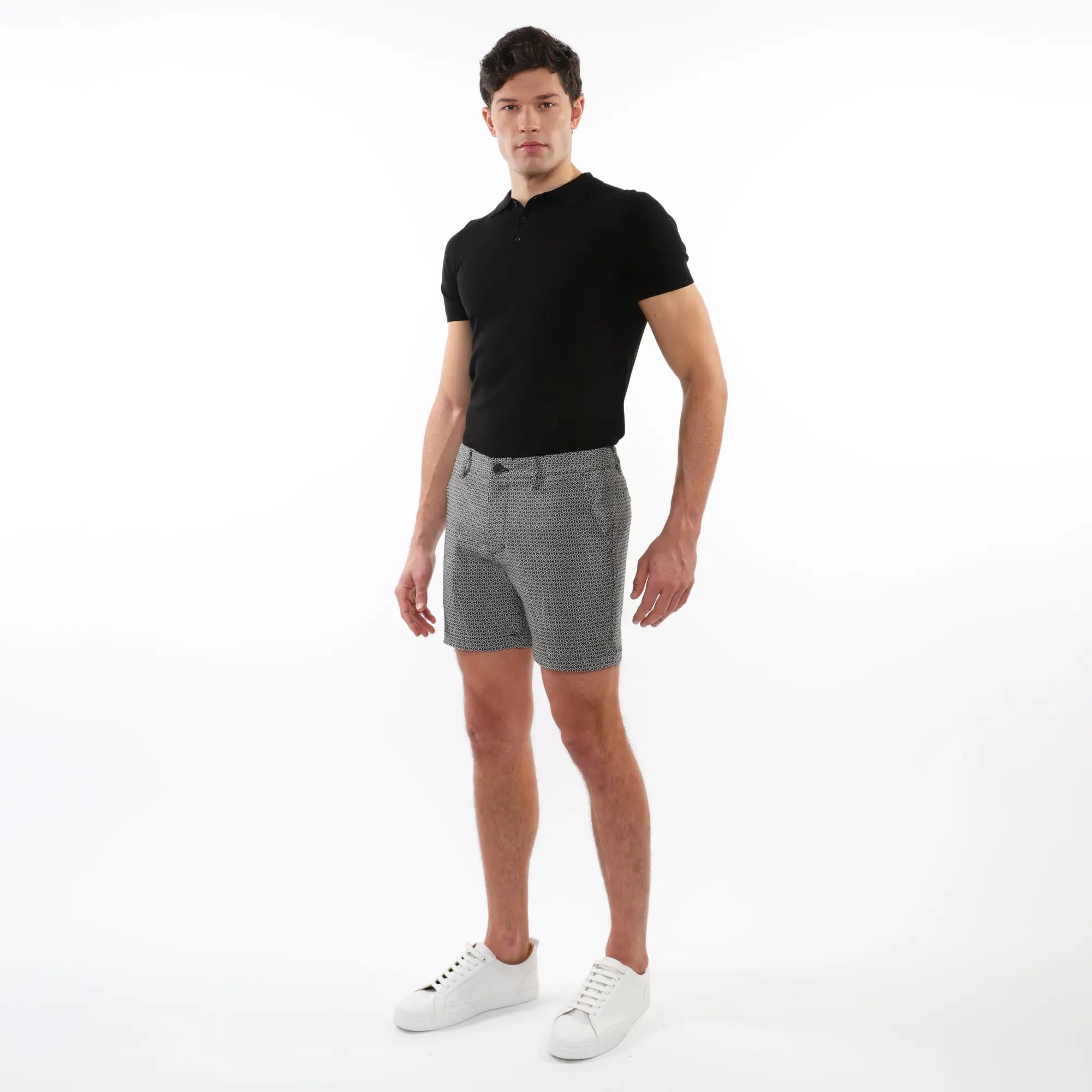 Black short-sleeved polo shirt with classic collar and buttoned placket for casual and smart wear