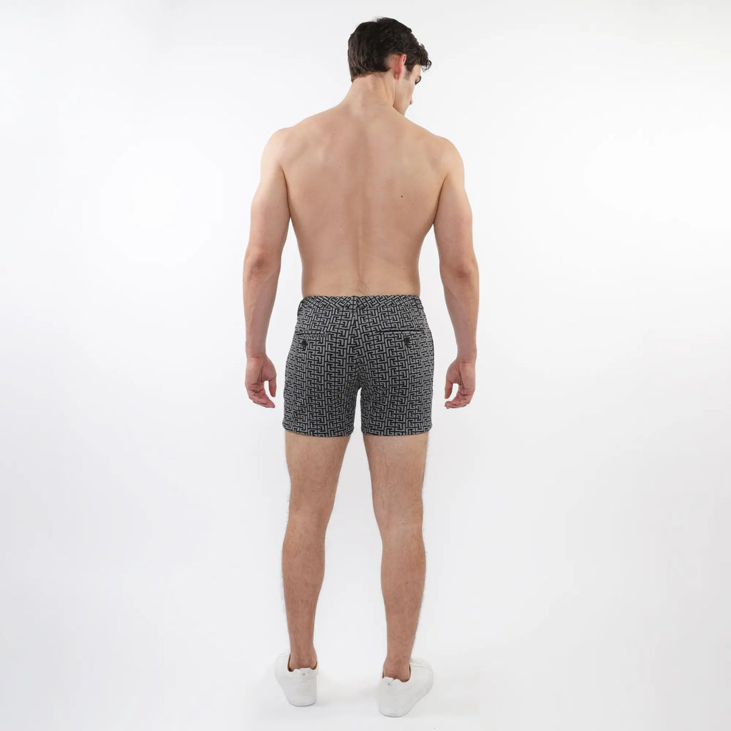 Black and white geometric-patterned textured jacquard stretch knit chino shorts with zip pockets