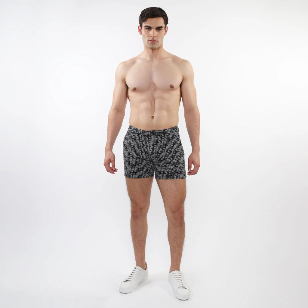 Black and white geometric patterned textured jacquard stretch knit chino shorts with zip pockets for men