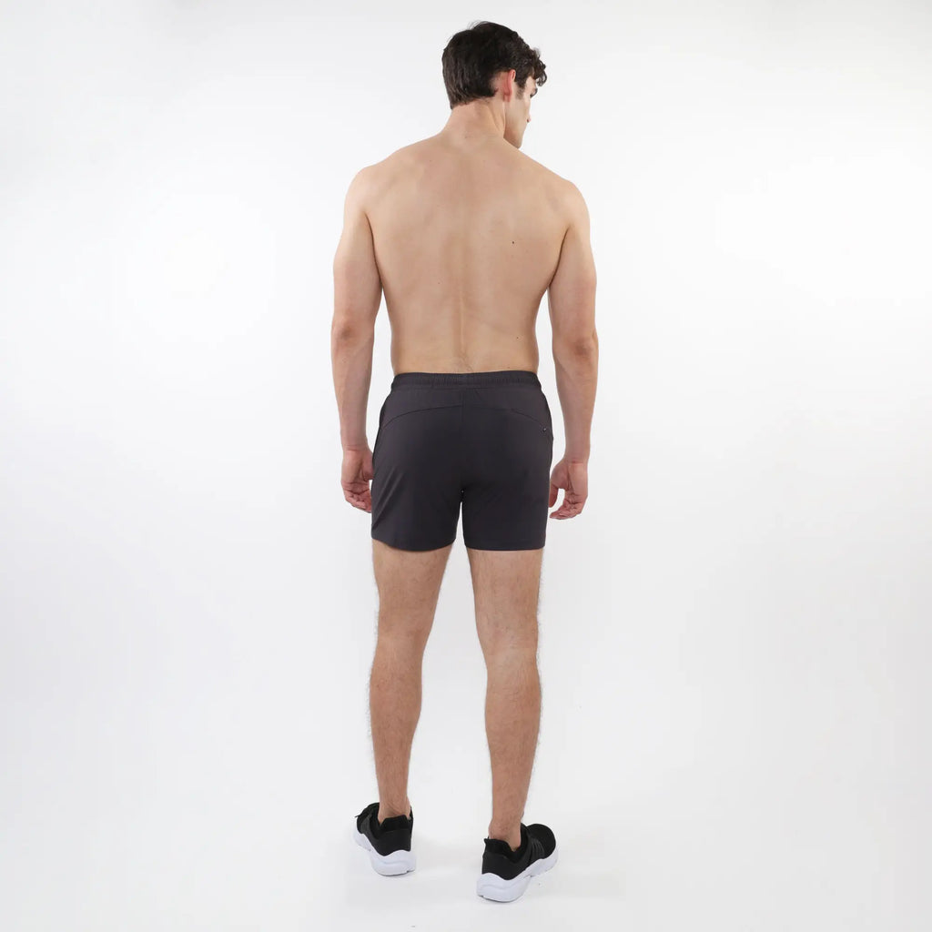 Black textured mesh stretch performance shorts with sleek form fitting design and subtle side pockets