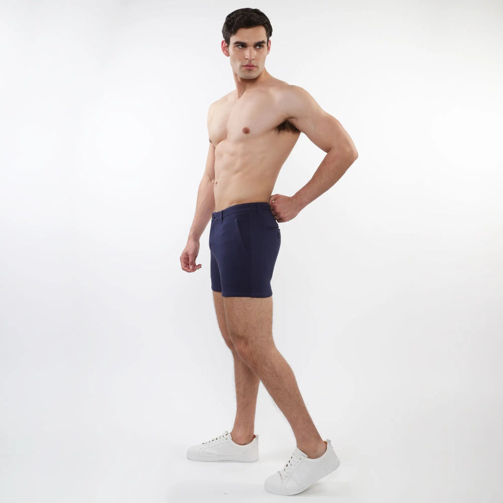 Navy blue men’s briefs with tailored fit and clean design paired with textured stretch knit chino shorts with zip pockets