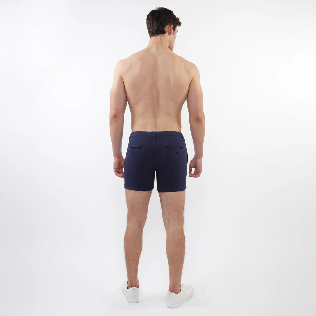 Navy blue textured stretch knit chino shorts with sleek modern design and subtle zip front pockets