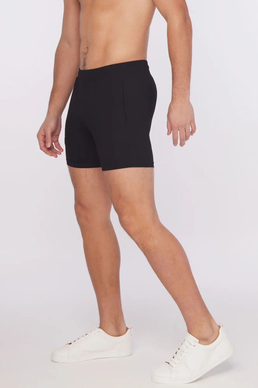 Black textured stretch performance shorts with sleek form-fitting design and subtle side pockets for athletic wear