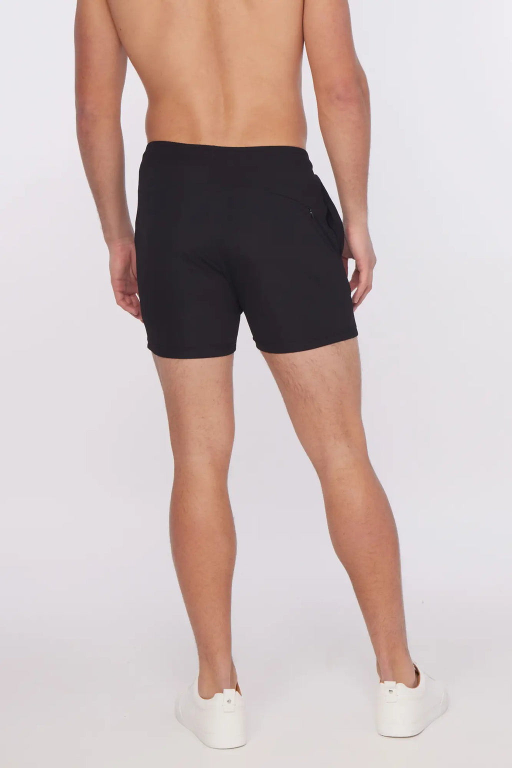 Black textured stretch performance athletic shorts with sleek modern design and subtle side pockets for active use
