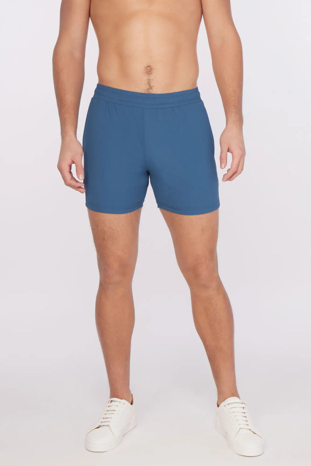 Blue textured stretch performance athletic shorts with a fitted waistband and clean minimalist design