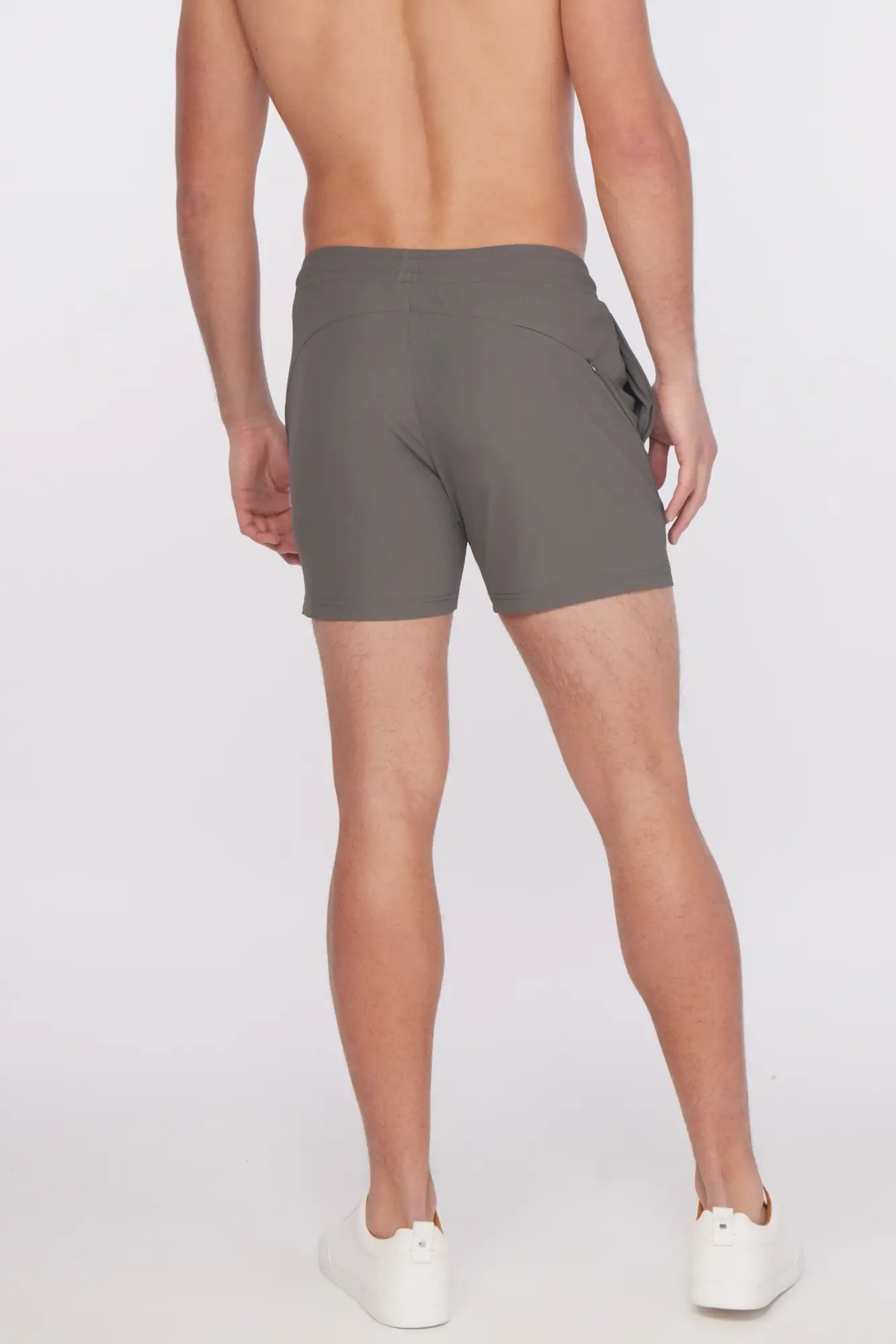 Gray textured stretch performance athletic shorts with sleek modern design and subtle side pockets for active wear