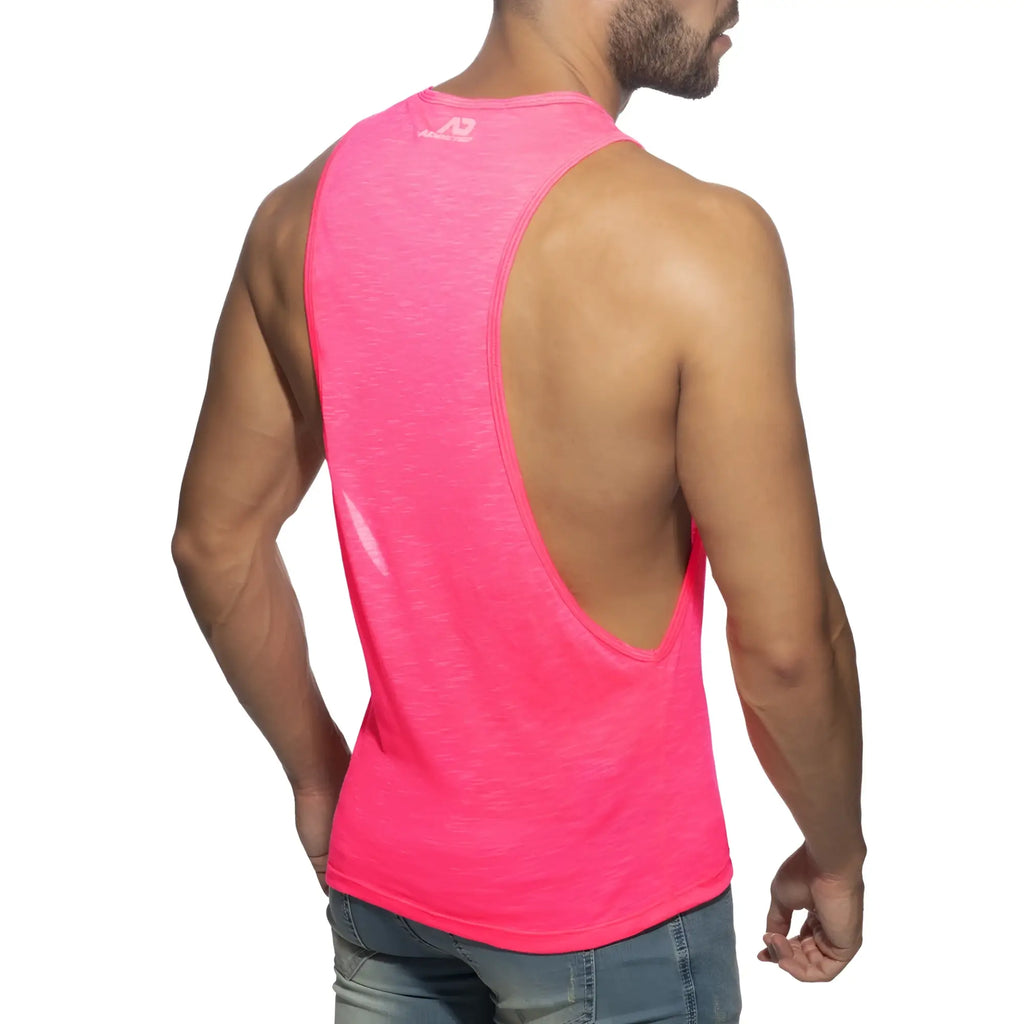 A vibrant pink sleeveless athletic tank top thin flame low rider with a deep back cutout and subtle logo at the neckline