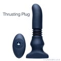Thunderplugs black silicone thrusting plug with a matching oval remote control, set against a white background.
