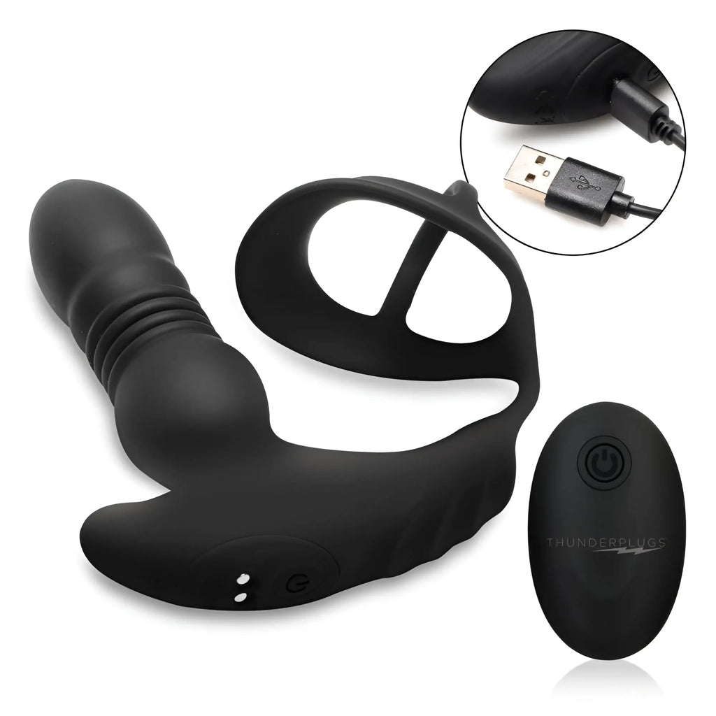 Black Thunderplugs thrusting vibrator with cock ring, remote control, and USB charging cable on a white background.