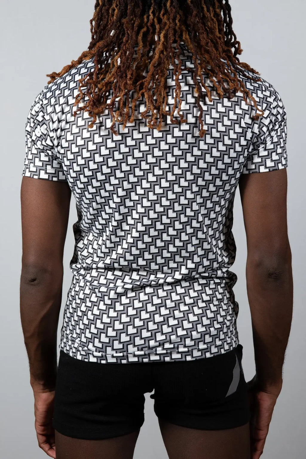 Black and white geometric patterned short sleeve athletic shirt tile print tee for activewear and casual use