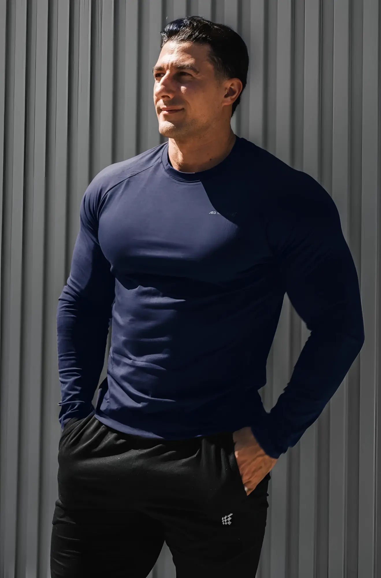 Navy titan muscle-fit long sleeve athletic shirt made from breathable fabric for enhanced performance and comfort