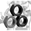 Tom of Finland 3-piece set of black, hexagonal, metal-style cock rings displayed against a classic character illustration.