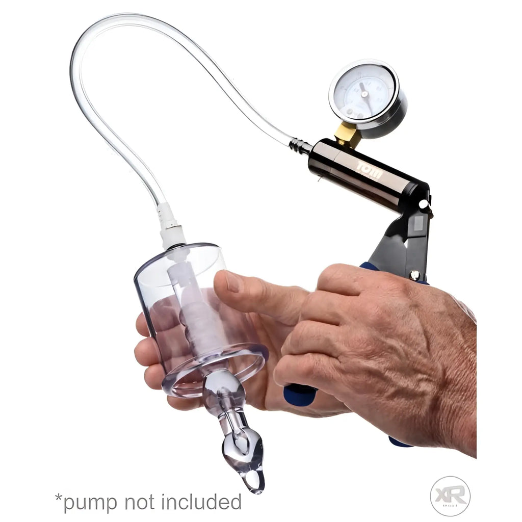 Tom of Finland Anal Pump Cylinder featuring a clear plastic chamber, internal stimulator shaft, and pressure gauge.